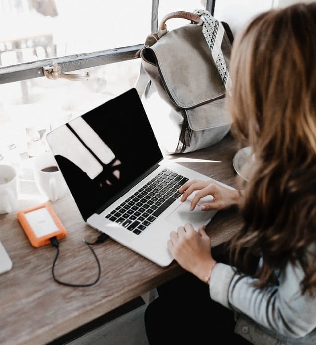 Girl working on assignment on computer